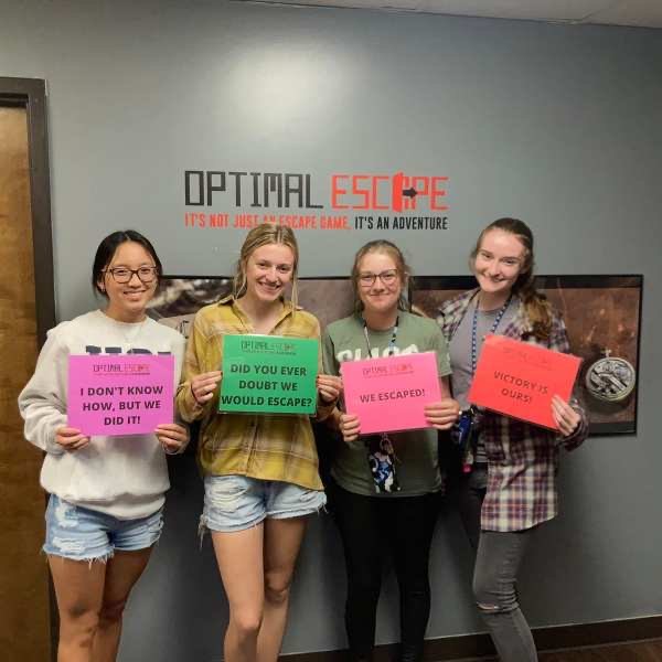 A winning team celebrating their escape at Optimal Escape in Evansville